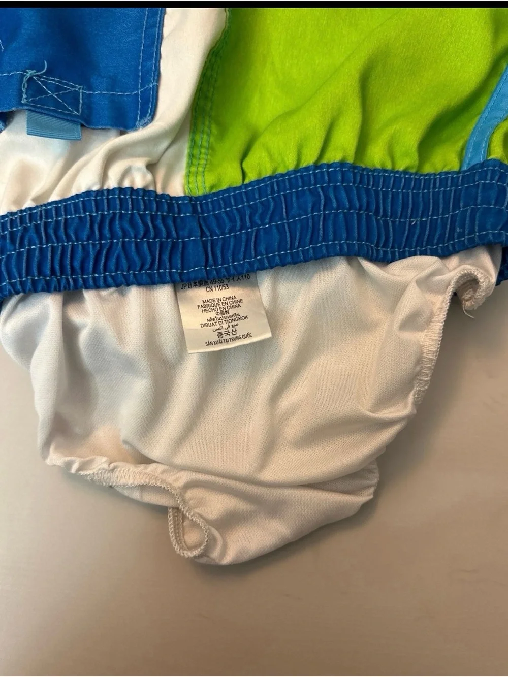 Disney Toy Story Patchwork Swim Shorts in Blue, Green & Purple